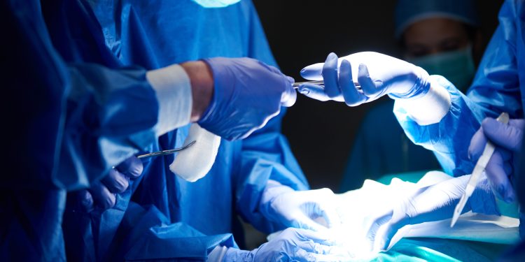 surgeons using surgical scissors